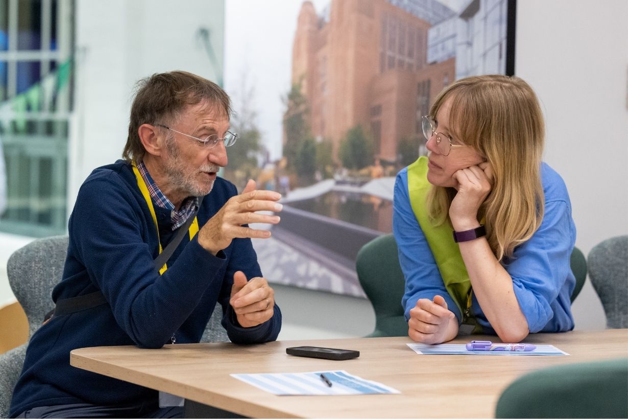 Two people discussing home energy