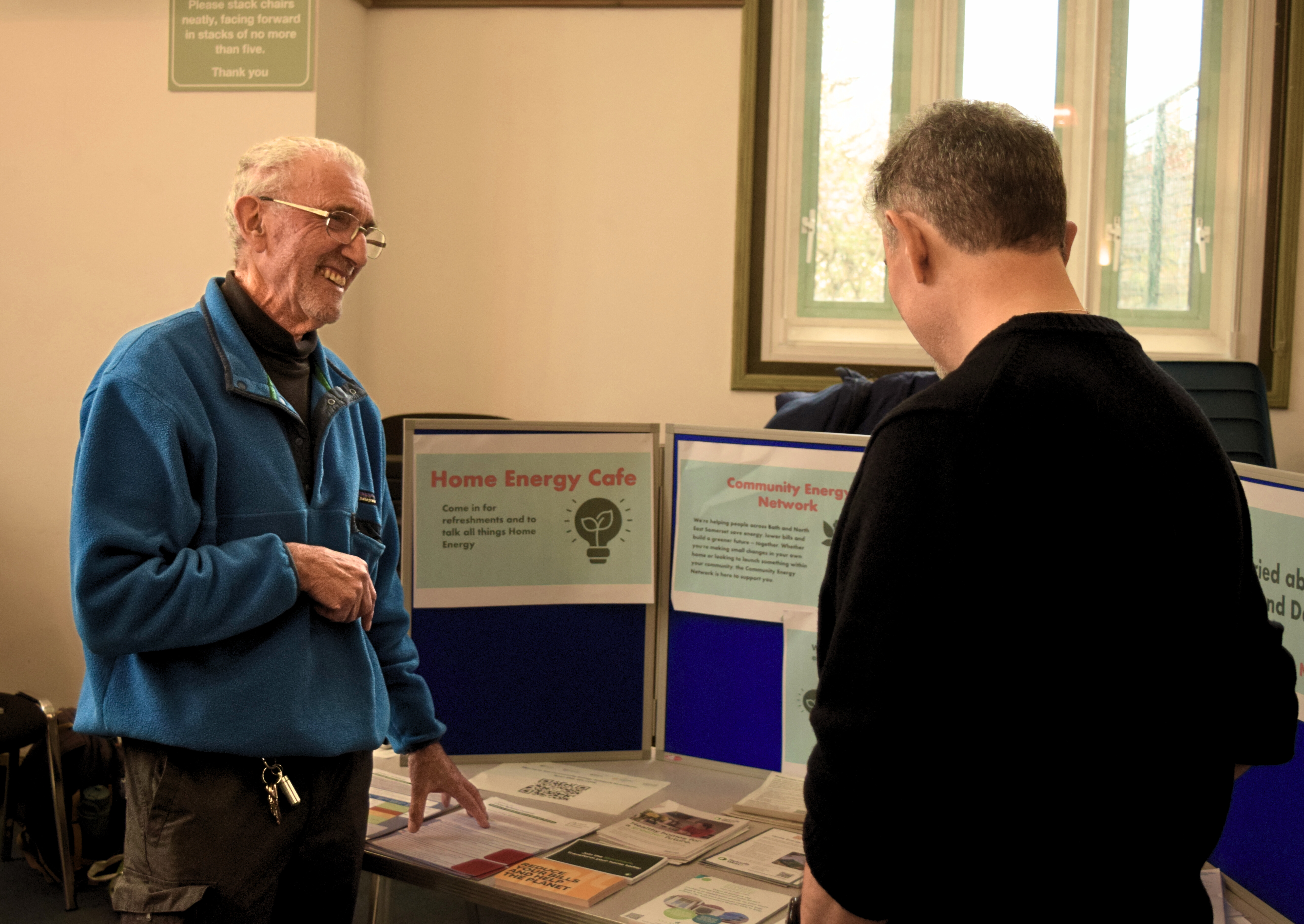 Energy champion volunteer helping at an event.