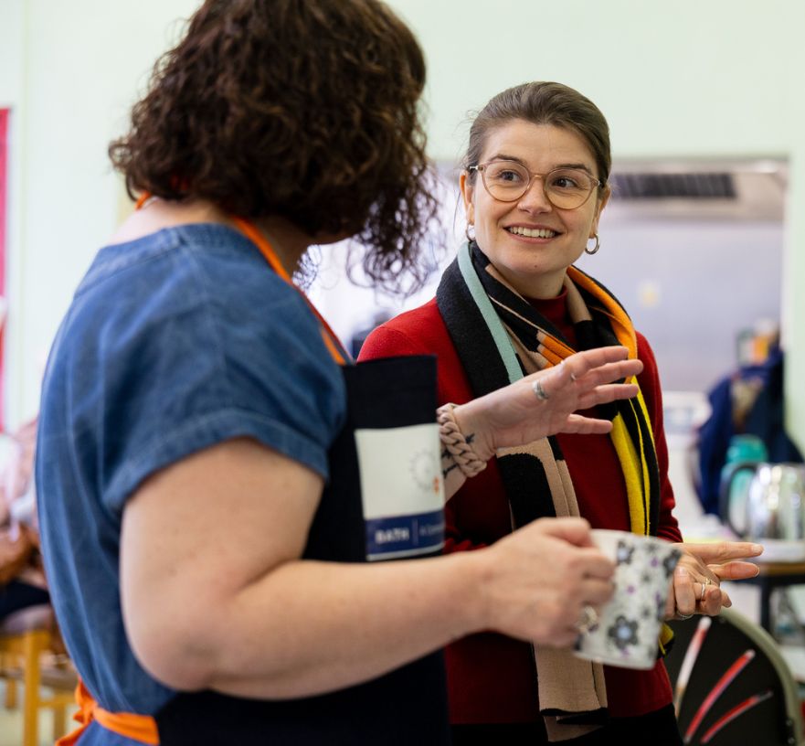 Two people chatting at a home energy event