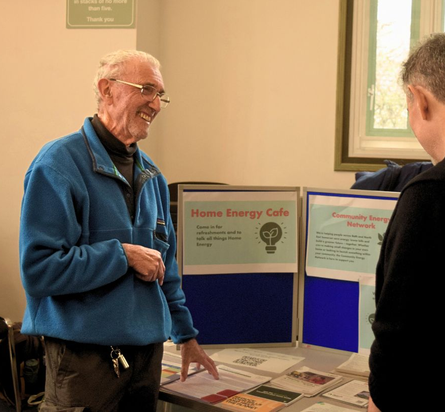 People chatting at a home energy drop in event