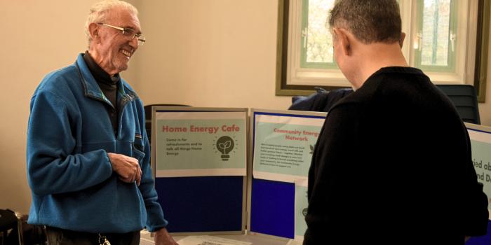 Energy champion volunteer helping at an event.