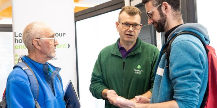 People discussing home energy at Bath Home Energy Fair