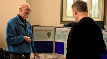 Energy champion volunteer helping at an event.