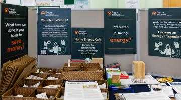 Energy cafe table with posters.